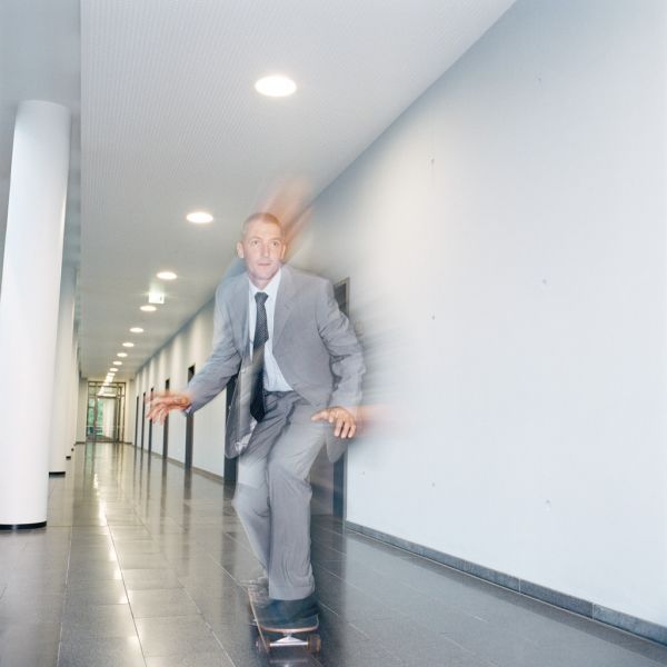 businessman on skateboard